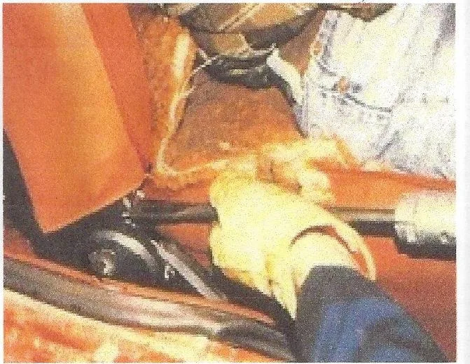 Air chisel cutting a seat bracket picture